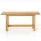 Teak wood bench with H-shaped legs, ideal for outdoor porch or patio, comfortably seats 2 people.