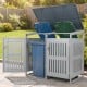 Outdoor trash can storage shed for 2 bins with gas struts, silver finish, ideal for garden or patio organization.