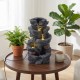5-tier tabletop water fountain with LED lights and realistic stone gray finish, creating a calming ambiance indoors.