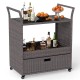 Outdoor wicker bar cart with tempered glass top, featuring ample storage, wheels for mobility, and stylish PE rattan.