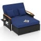 Outdoor wicker daybed in dark blue with adjustable backrest, storage ottoman, and comfortable cushions for patio.