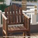 Outdoor wooden armchair with a smooth surface and sturdy structure, perfect for patio relaxation and dining.
