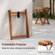 Foldable outdoor wood tray table with supportive webbing, ideal for easy storage and serving in patios or gardens.