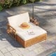 Outdoor wooden daybed with adjustable backrest and removable cushions, perfect for poolside relaxation.