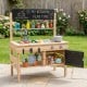 Wooden outdoor mud kitchen for kids with sink, stove, storage, and blackboards for imaginative play and creativity.