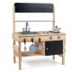 Wooden outdoor mud kitchen for kids featuring sink, stovetop, storage cabinet, and blackboards for imaginative play.