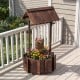 Outdoor wooden wishing well planter with a rustic design, showcasing vibrant flowers in the sturdy Fir wood structure.