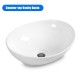 Elegant oval ceramic vessel sink showcasing a glossy finish and popup drain design, ideal for stylish bathroom.