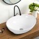 Sleek oval ceramic vessel sink featuring a smooth, high-gloss finish and innovative popup drain, ideal for modern.