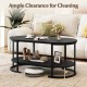 Oval black coffee table with 2-tier storage shelf and 5-inch clearance for easy cleaning, perfect for living room use.