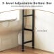 3-level adjustable bottom bar of the black over-the-toilet cabinet organizer for varying pipe positions.