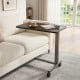 Overbed table with walnut finish, lockable wheels, and sturdy H-shaped base, ideal for home or hospital use.