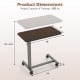 Overbed table with walnut finish features a 28" x 15" surface, adjustable height, and lockable rolling wheels for stability.