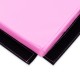 Close-up of a pink 4' x 6' x 2" PU thick folding exercise mat with Velcro edges for easy connection and storage.