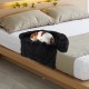 Plush calming dog couch bed with anti-slip bottom, featuring soft fabric and removable bolster for pet comfort on a bed.