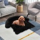 Plush calming dog couch bed with anti-slip bottom, featuring soft fabric and removable bolster for comfort and support.