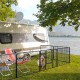8-panel 24-inch height pet fence with door, ideal for outdoor use by a camper, ensuring safety and easy access.