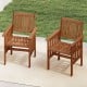 Set of 2 outdoor solid wood patio chairs with slatted seats and inclined backrests, ideal for backyard relaxation.