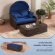 Patio PE rattan daybed with retractable canopy, navy cushions, and removable ottoman for versatile outdoor lounging.