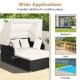 Patio rattan daybed with retractable canopy and soft cushions, perfect for backyard or poolside relaxation.