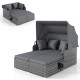 Patio rattan daybed with retractable canopy and soft cushions, featuring foldable side tables for outdoor relaxation.