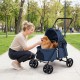 Pet stroller for small to medium dogs in navy, featuring a foldable design, breathable mesh, and 360° swivel wheels.