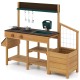 Wooden toy kitchen playset for kids featuring two stoves, a sink, and ample storage for outdoor imaginative play.