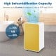 Portable yellow dehumidifier removes up to 32 pints of moisture daily, ideal for rooms up to 2500 sq. ft.