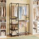 Portable black closet with double hanging rods, adjustable pants hangers, and 4 open shelves for versatile storage.