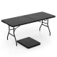 Portable folding camping table in black with a large tabletop, sturdy steel frame, and carrying handle for easy.