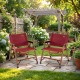 Two red portable folding camping chairs with bamboo frames in a lush garden setting, perfect for outdoor relaxation.