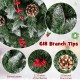 Close-up of the pre-lit artificial pencil Christmas tree featuring 33 natural pine cones and 32 clusters of red berries.