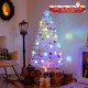 5-foot pre-lit white artificial Christmas tree with iridescent leaves and multi-color LED lights, perfect for festive.