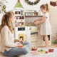 Beige pretend toy kitchen set showcasing a child cooking with stoves, featuring realistic sounds and colorful.