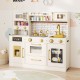 Beige pretend toy kitchen set featuring a close-up of the stove knobs and microwave for realistic play experiences.