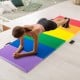 Colorful PU leather tri-folding gymnastics mat with EPE foam, ideal for yoga and stretching, shown in use during a.