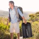 Two-person waterproof sleeping bag in black with pillows, perfect for camping and outdoor adventures.