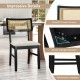 Black rattan dining chair with padded seat, rubber wood legs, and breathable backrest for comfortable kitchen seating.