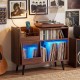 Record player stand in brown features a sliding tempered glass door and LED light for stylish album storage and access.