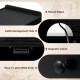 Close-up of the Record Player Stand's cable management hole and raised edges, featuring a durable black finish.