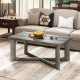 Rectangle coffee table in gray rubber wood with X-shaped base, showcasing rounded corners and metal connectors for.
