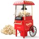 Retro hot air popcorn maker in red with measuring cup, producing oil-free popcorn for family movie nights.