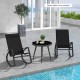 Black outdoor rocking chairs with ergonomic backrest, perfect for poolside relaxation. Table not included.