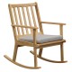 Natural solid rubber wood rocking chair with a padded seat cushion, designed for comfort and relaxation in any home.