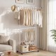 Double-rod rolling clothes rack with extendable top rod, adjustable height, and extra storage for versatile.
