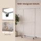 Rolling clothes rack with double rods and adjustable height, featuring thickened metal tubes and wheels for easy.