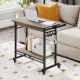 Rolling laptop table in grey with pull-out keyboard tray, hooks, and bottom shelf for convenient workspace organization.