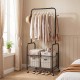 Rolling black metal clothes rack with hanging rod and storage basket, perfect for organizing clothing and accessories.