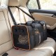 Foldable soft-sided pet carrier with breathable mesh windows, safety leash, and wheels for easy travel in a car.