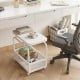 Rolling side table with a faux marble top and mesh storage basket, perfect for small spaces and easy repositioning.